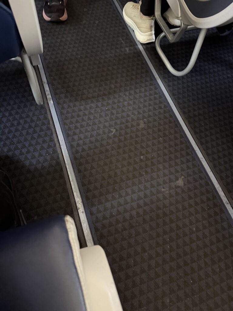 Worn and mucky carpet on the Aegean A321neo