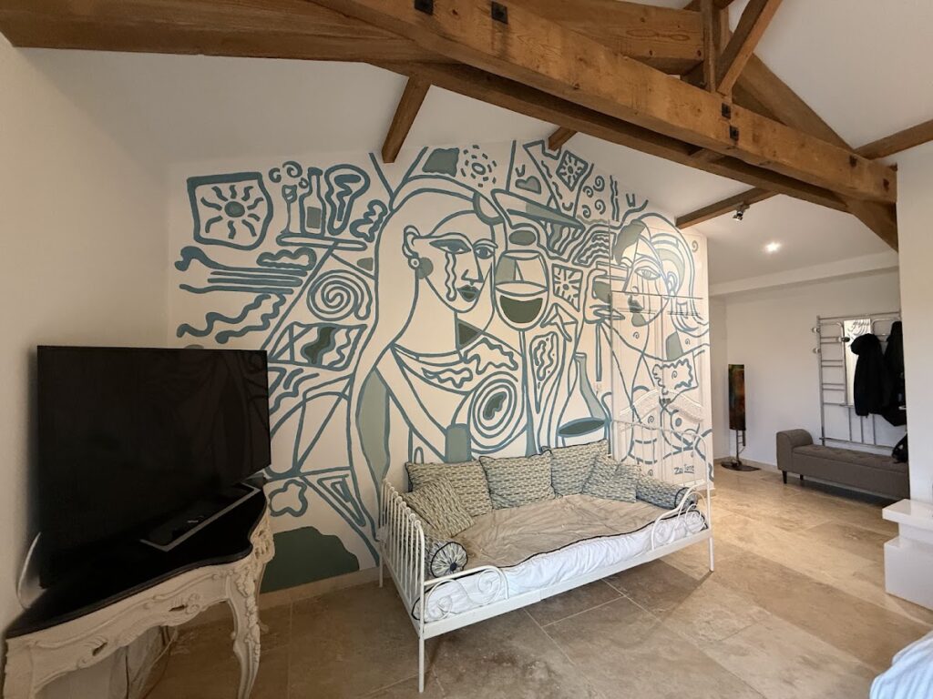 TV and chaise in our room at Chateau du Palanquey