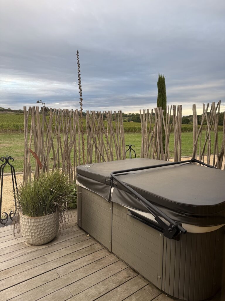 Private hot tub outside the room at Chateau du Palanquey
