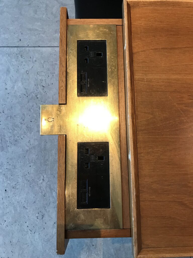 Clever pull-out charging drawers in the Cathay Lounge Heathrow