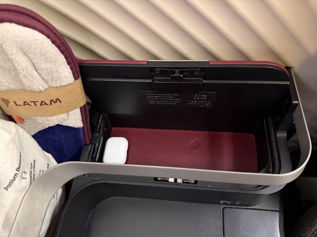 Further storage on the side console in 777-300 Premium Business