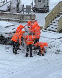 Ramp staff at Schiphol build a snowman