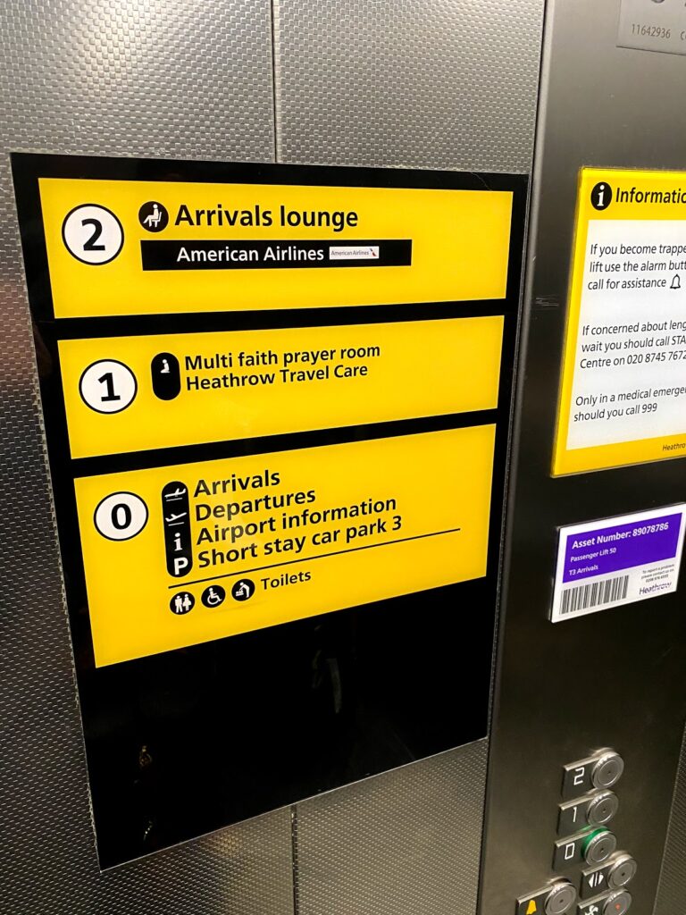 Signage to the American Airlines Arrivals Lounge