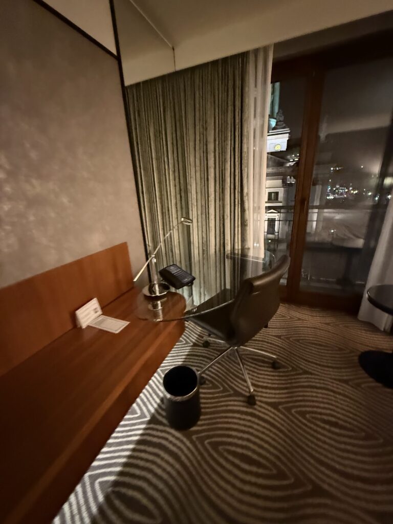 Desk and chair in my room at Hilton Berlin