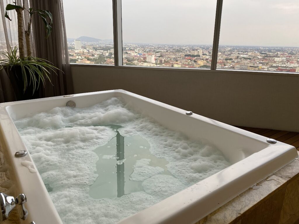 Bubble bath with panoramic city views at Hilton Mexico City