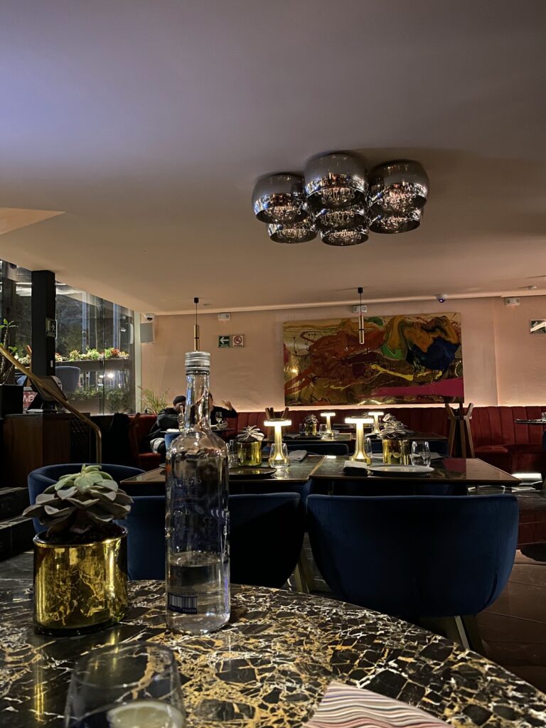 Stylish hotel restaurant with velvet seating and artwork