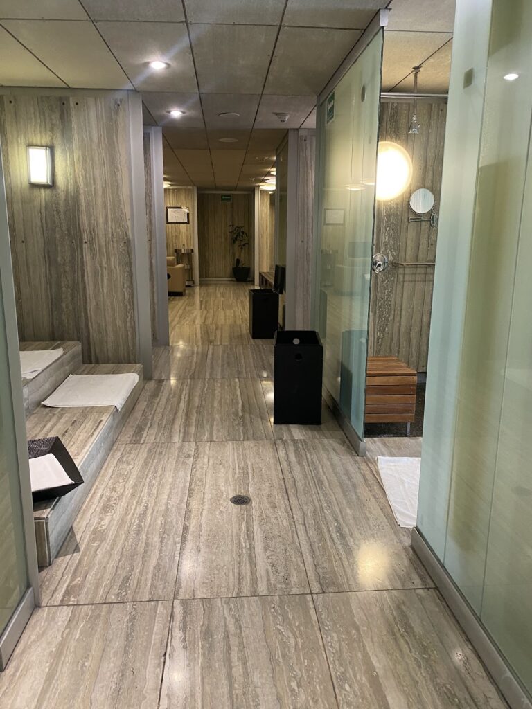 Marble spa changing room with glass shower stalls