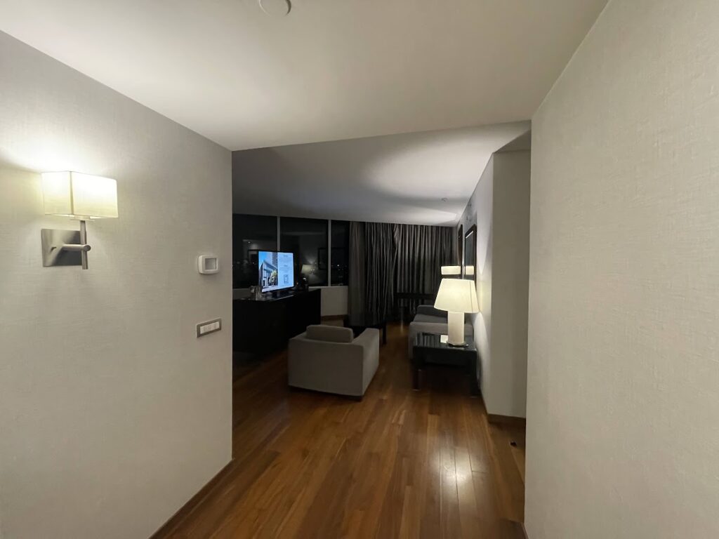 Spacious corner suite living area with hardwood floors