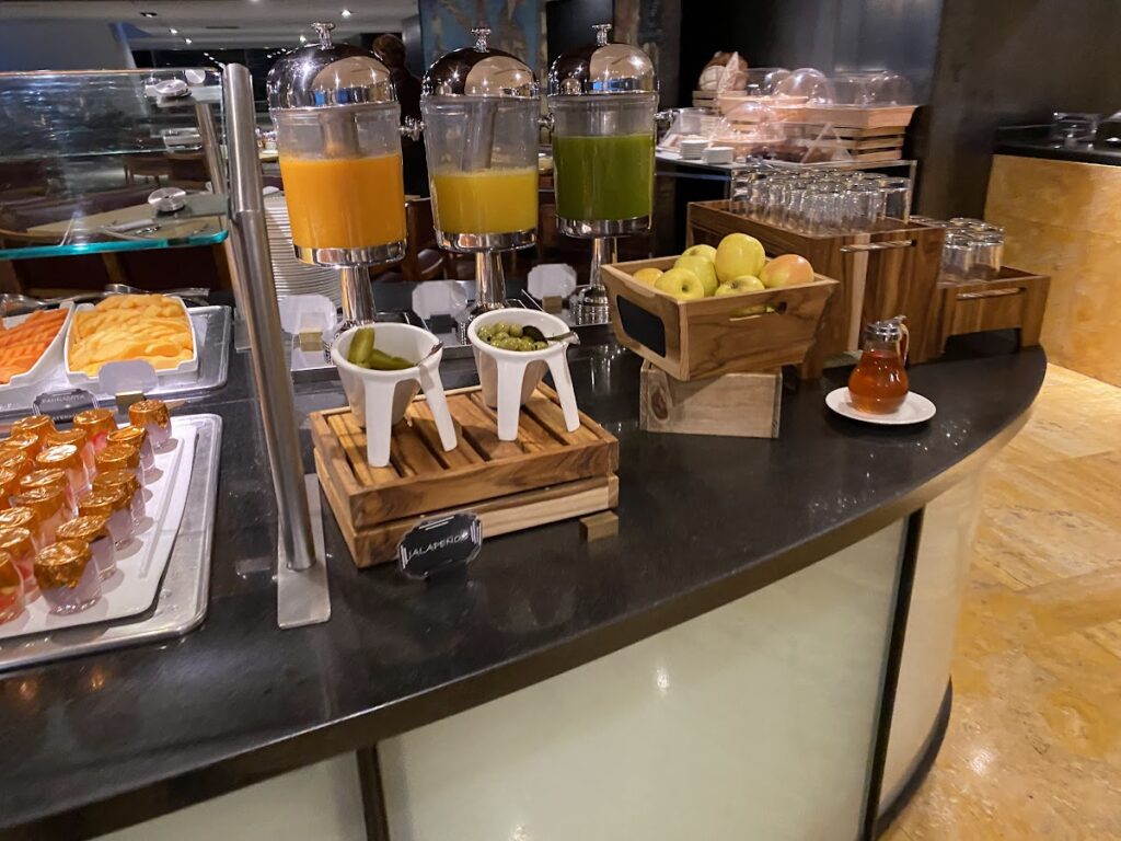 Breakfast buffet with juices and fruit at the Hilton