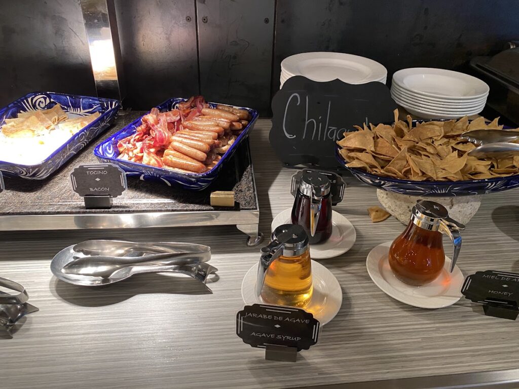 Breakfast buffet with chilaquiles and bacon selections
