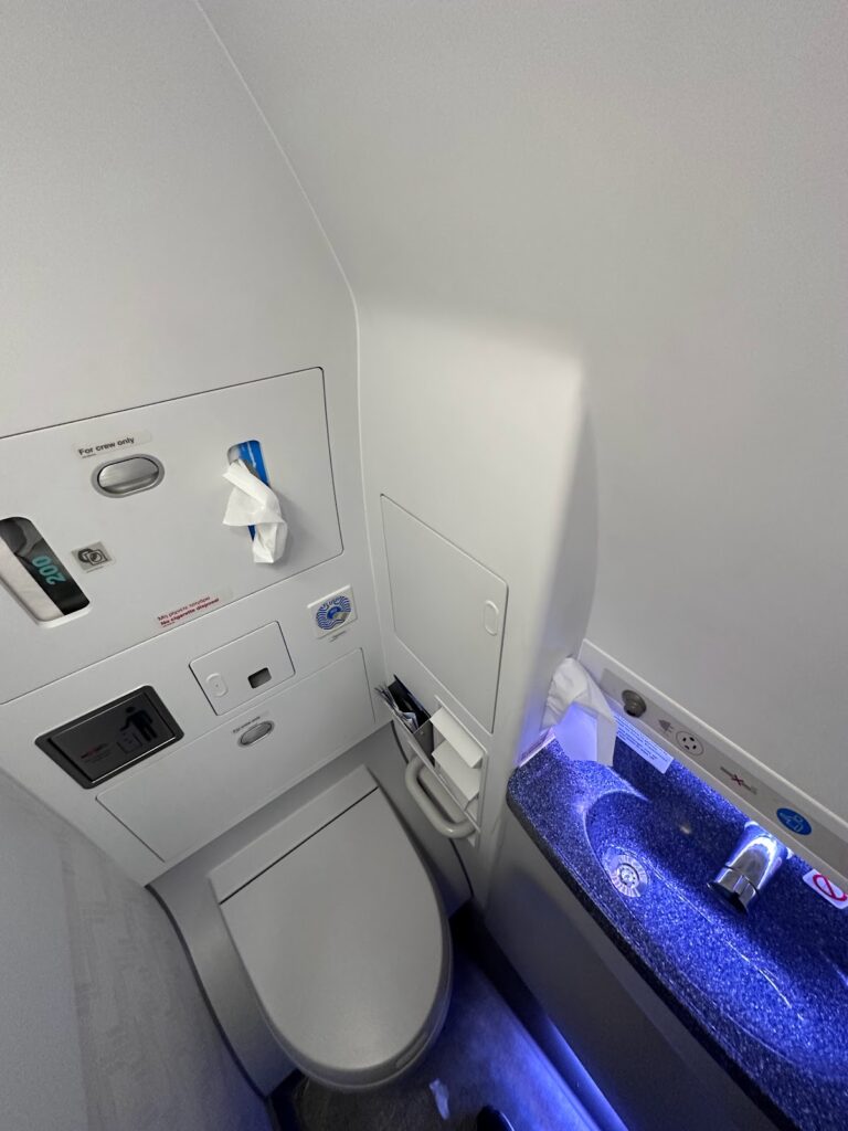Aegean A321neo lavatory with blue-lit sink