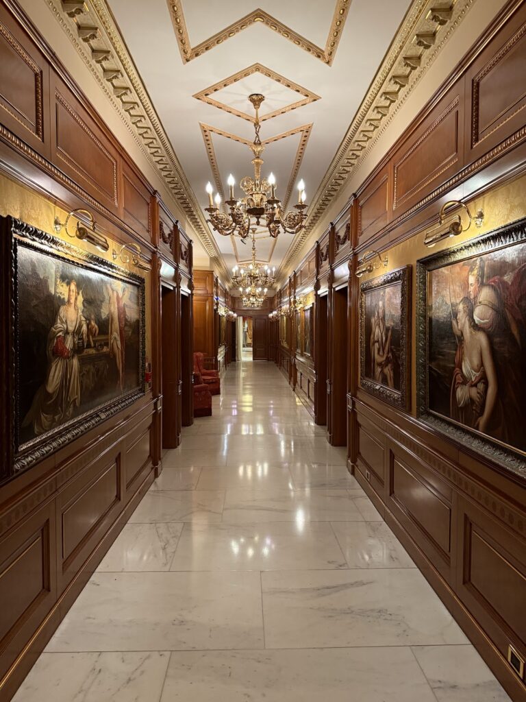 Grand corridor with paintings at Parco dei Principi Hotel Rome