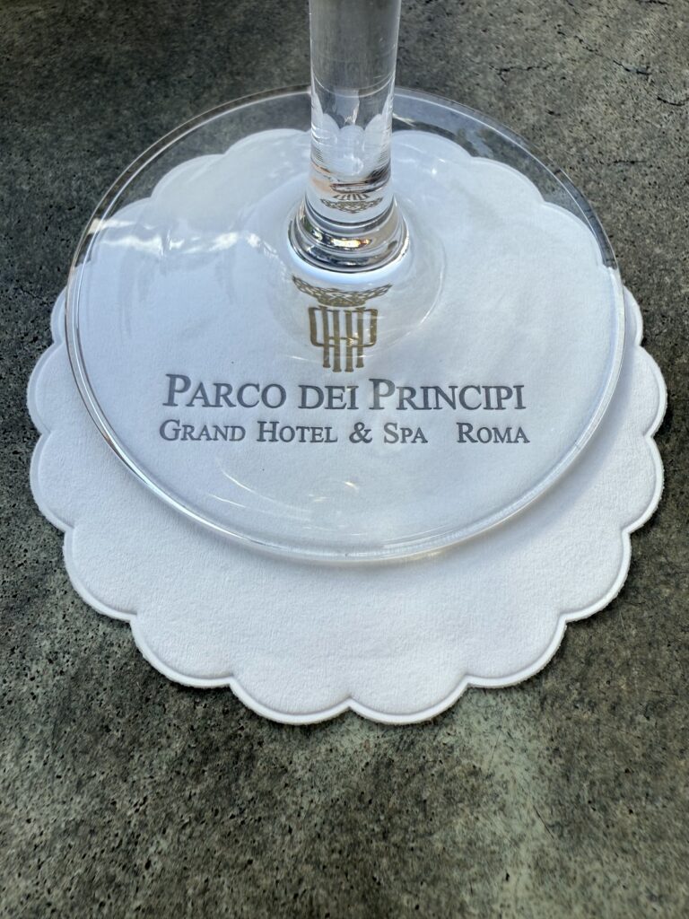Branded coaster and glass at Parco dei Principi Rome