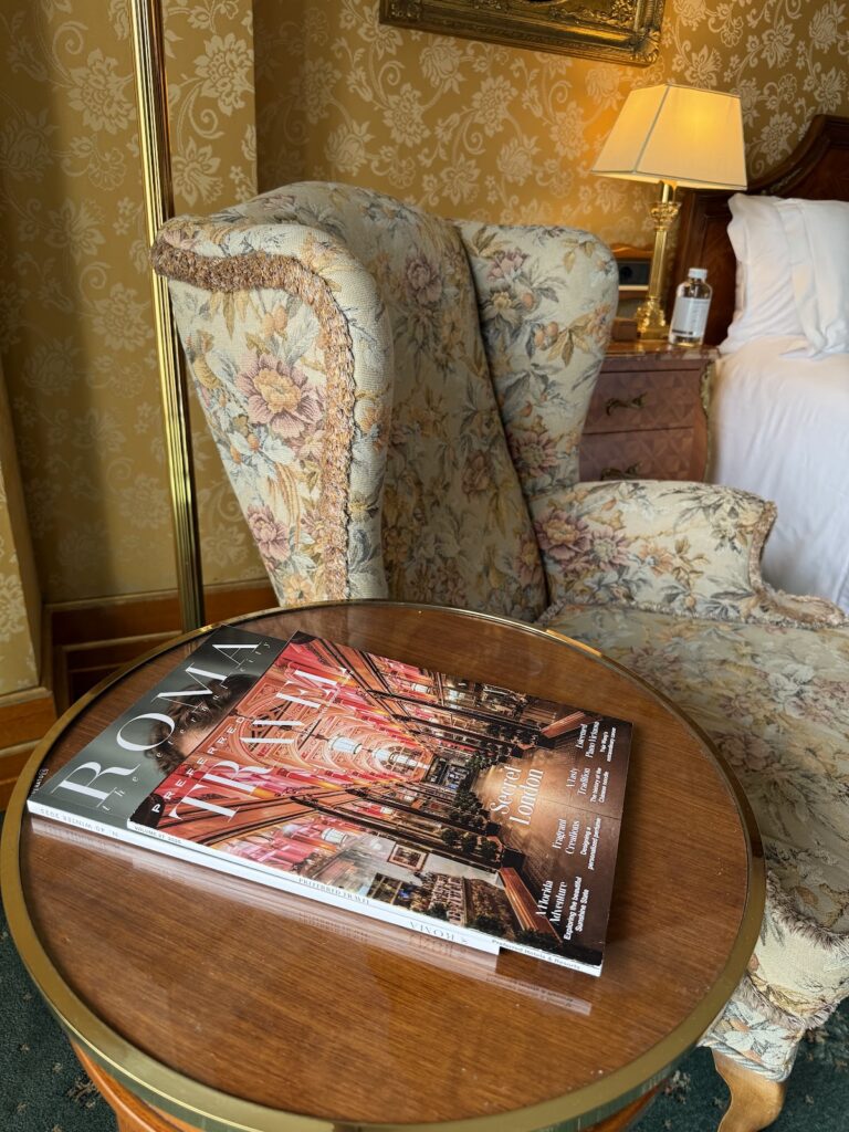 Travel magazines on side table in hotel room