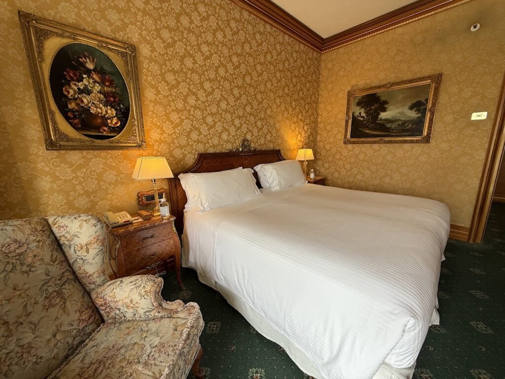 Parco dei Principi Hotel Rome bedroom with ornate paintings