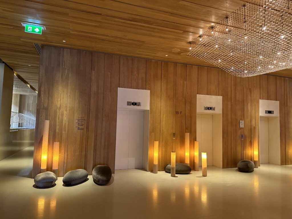 Elevator lobby with warm wood panelling at Hilton Pattaya
