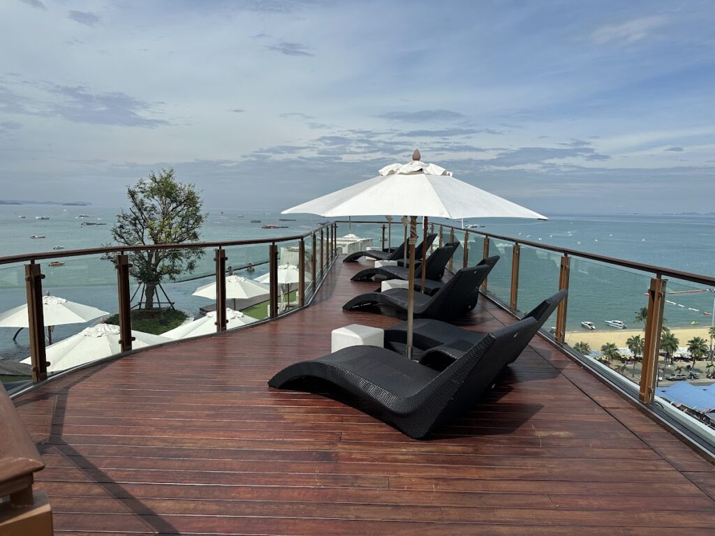 Rooftop sun loungers overlooking Pattaya Bay at Hilton