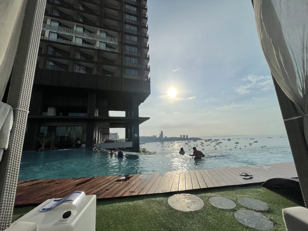Sunset over Hilton Pattaya infinity pool and cabanas