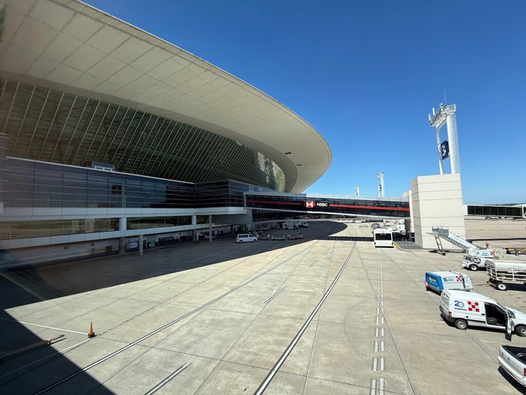 Montevideo Carrasco Airport terminal and apron on sunny day