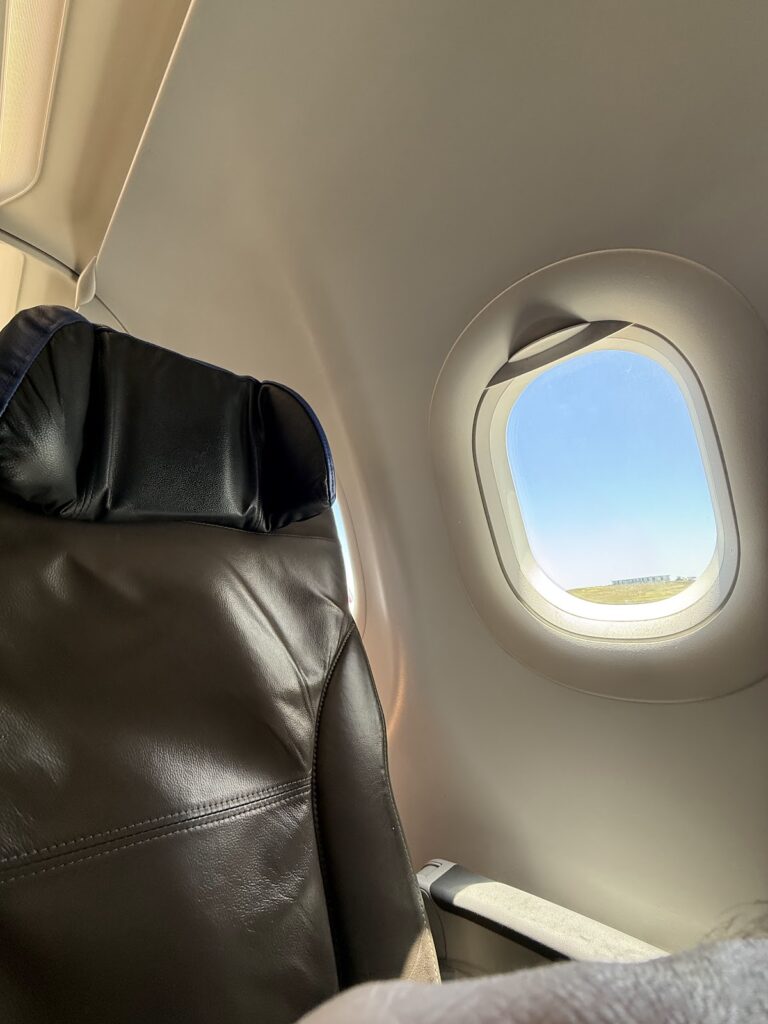 Black leather seat in LATAM A321 Premium Economy cabin