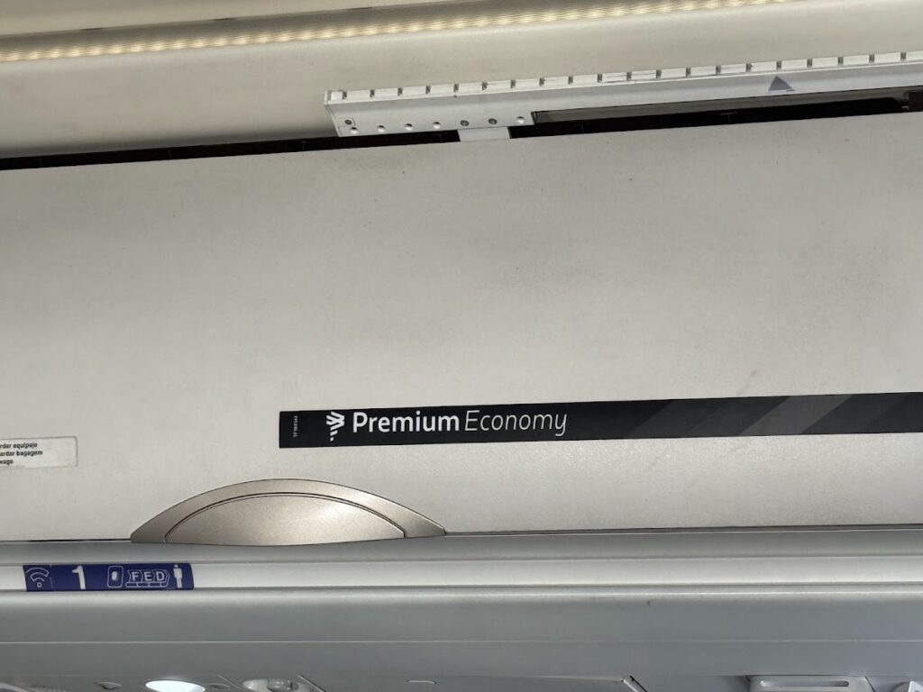 LATAM A321 Premium Economy overhead bin branding