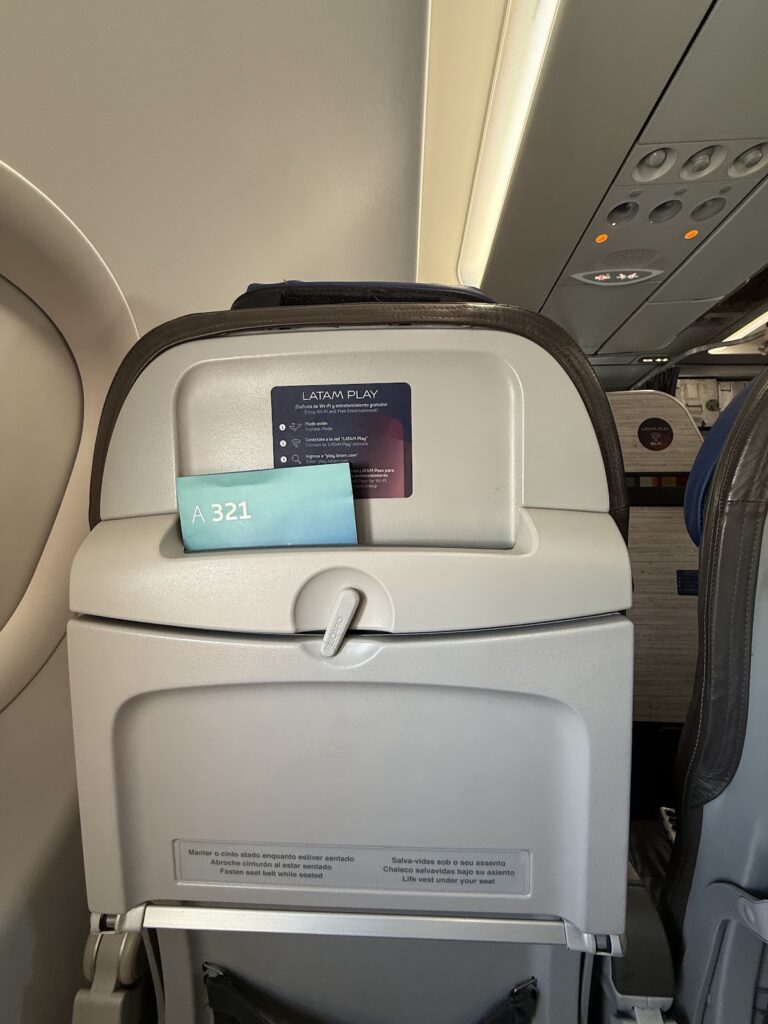 LATAM A321 Premium Economy seatback with safety card