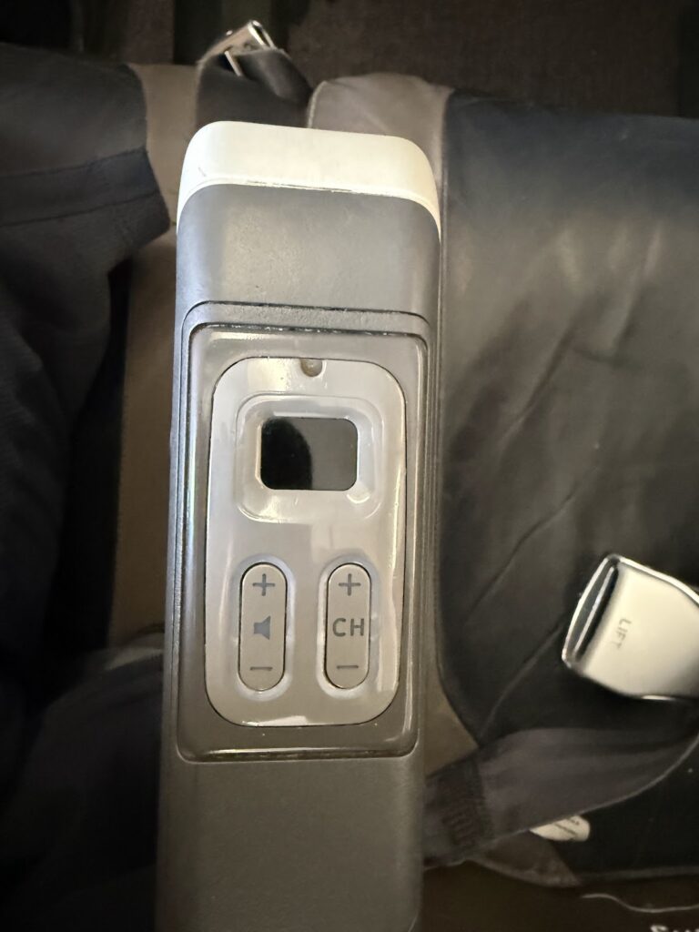 Armrest audio controls on LATAM A321 Premium Economy seat