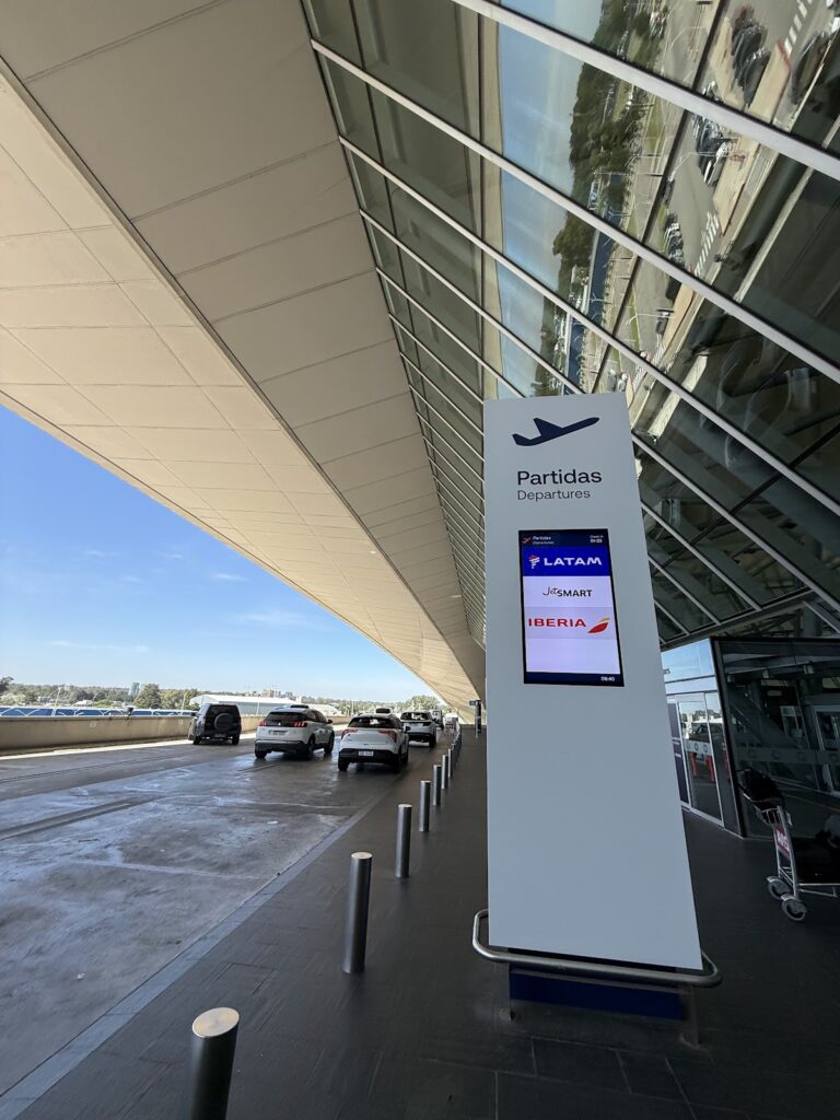 Montevideo airport departures sign showing LATAM flights
