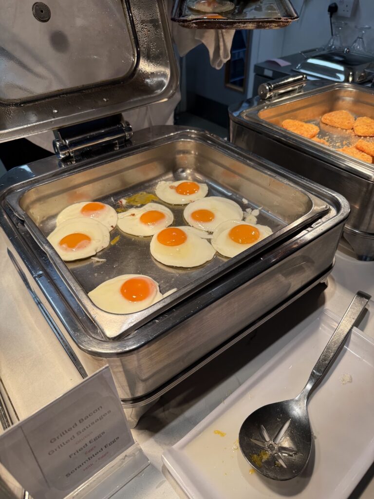 Fried eggs on the breakfast buffet at the hotel