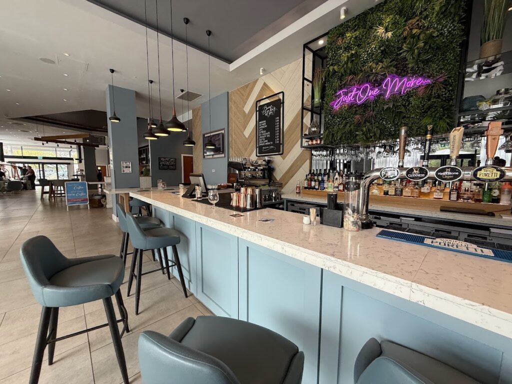 Bar area at Hilton Garden Inn Abingdon with neon sign