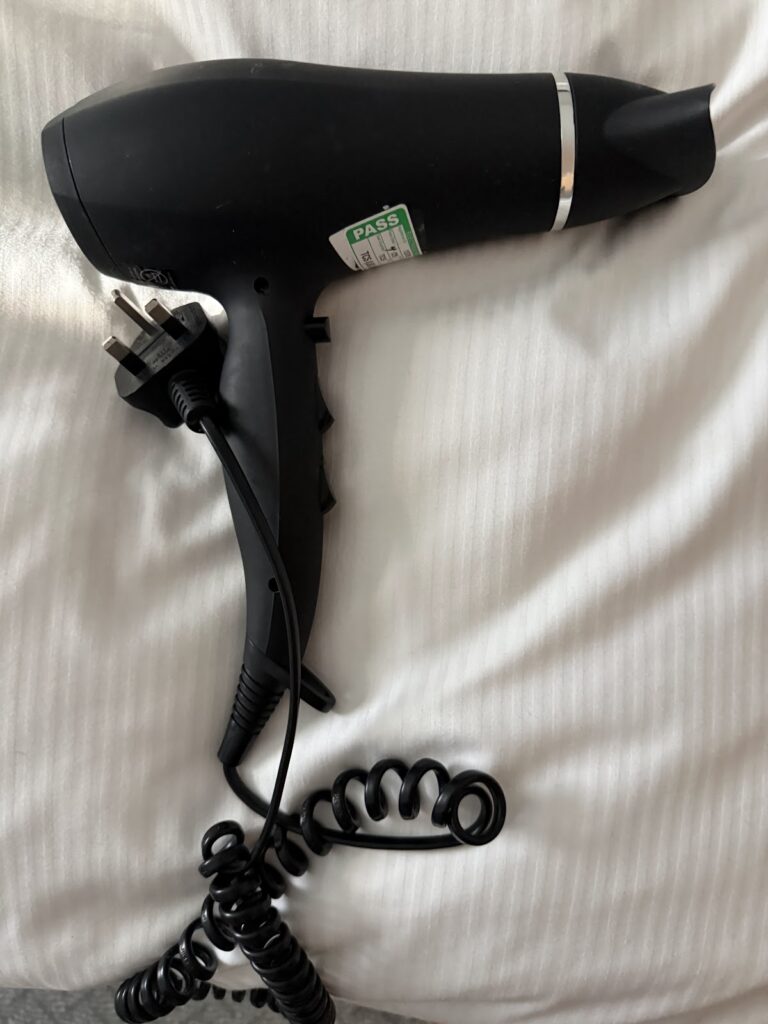 Black hairdryer provided at Hilton Garden Inn Abingdon
