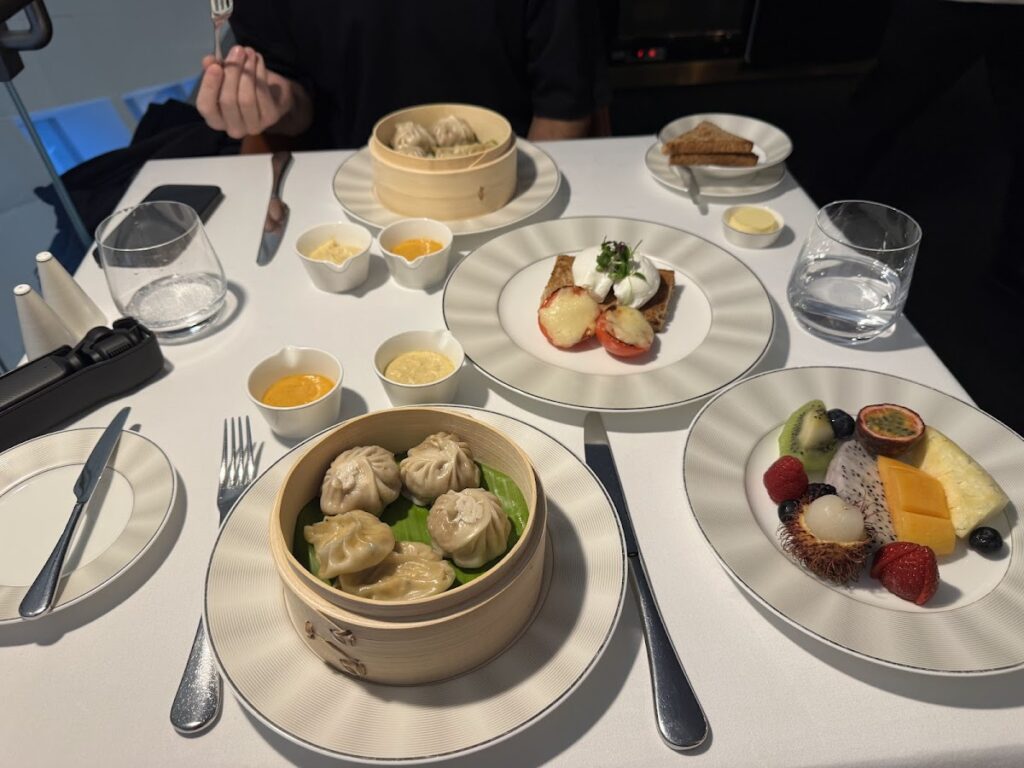 Dumplings, fruit, and dishes at Etihad First Class Lounge