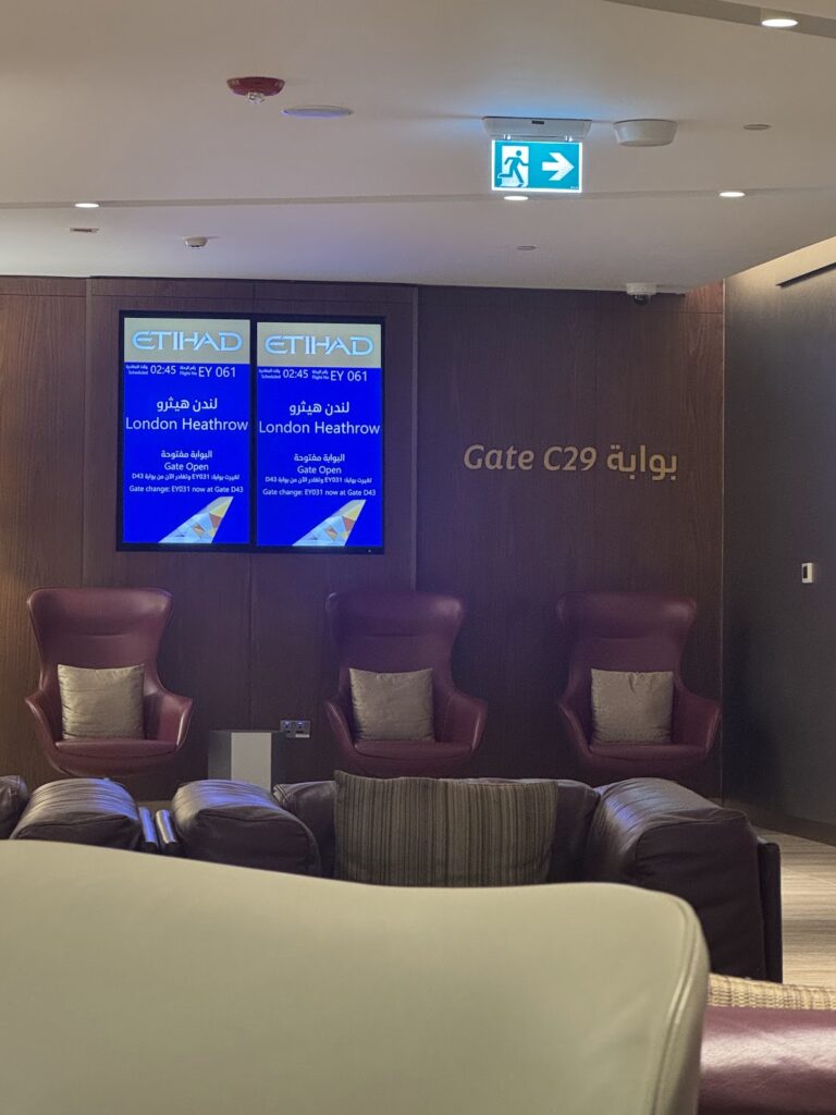 Gate C29 seating and flight screens in Etihad lounge