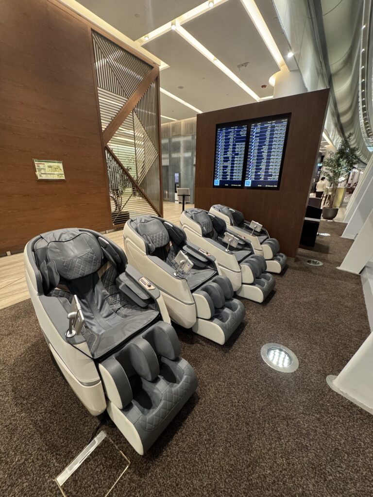 Massage chairs inside the Etihad First Class Lounge