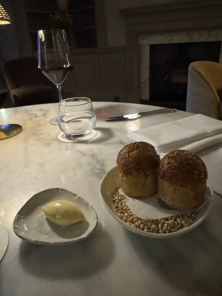 Freshly baked bread rolls with butter at dinner
