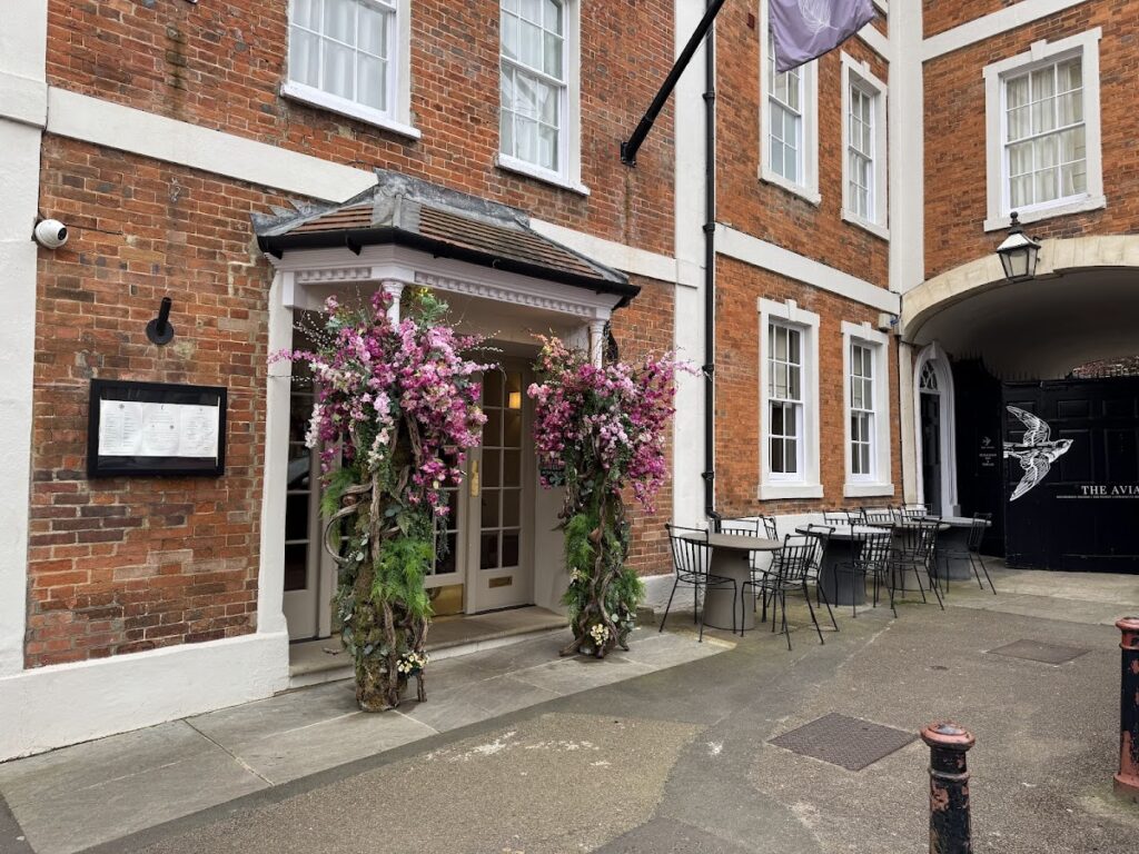 The Feathers Hotel Woodstock entrance with floral displays
