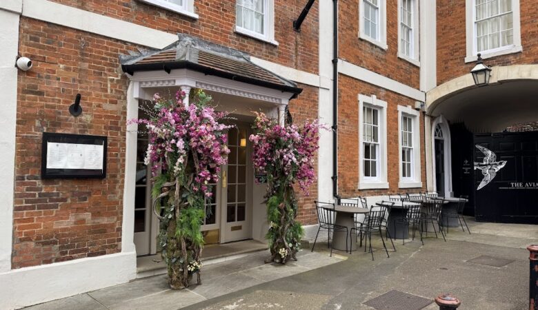 The Feathers Hotel Woodstock entrance with floral displays