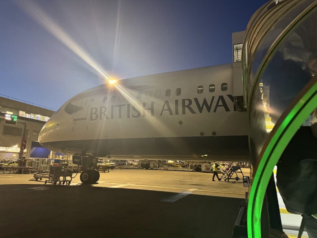 British Airways 787 Dreamliner at gate at dusk