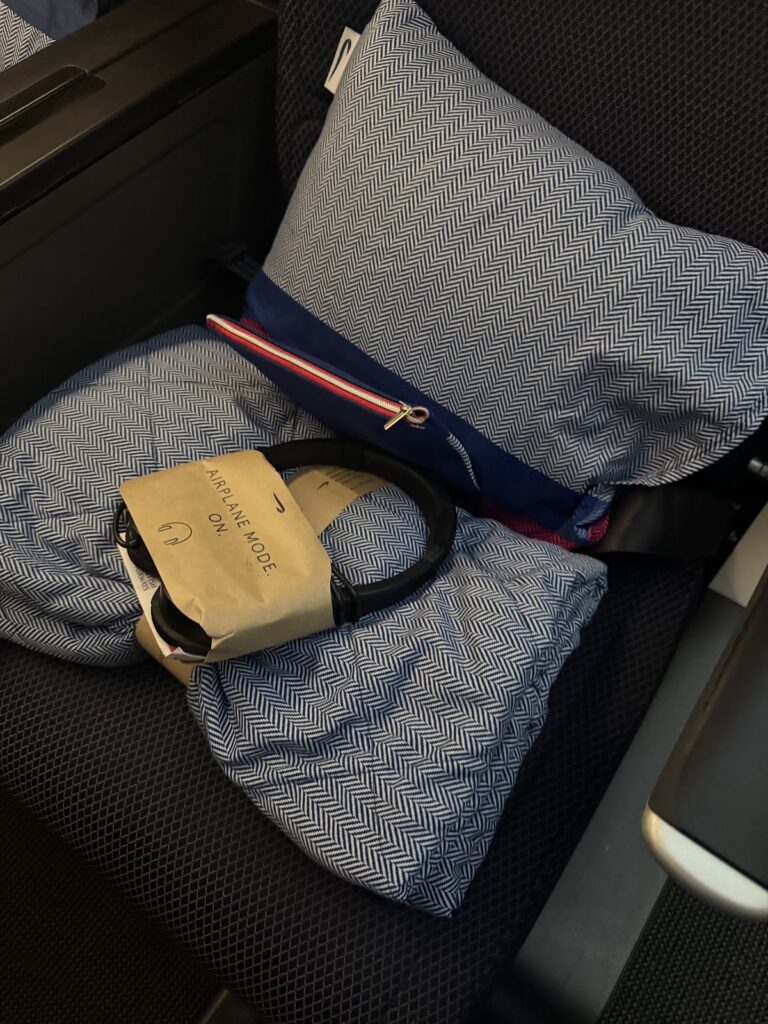 BA premium economy amenity kit headphones pillow and blanket