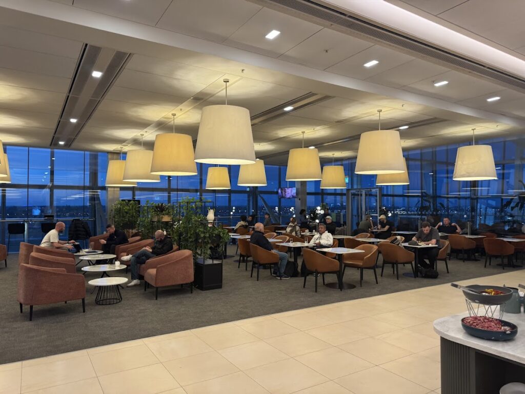 Seating area inside British Airways Galleries North Lounge evening