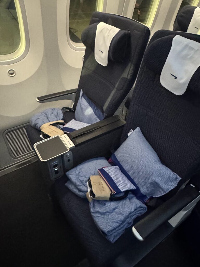 BA premium economy seats with pillows and amenity kits