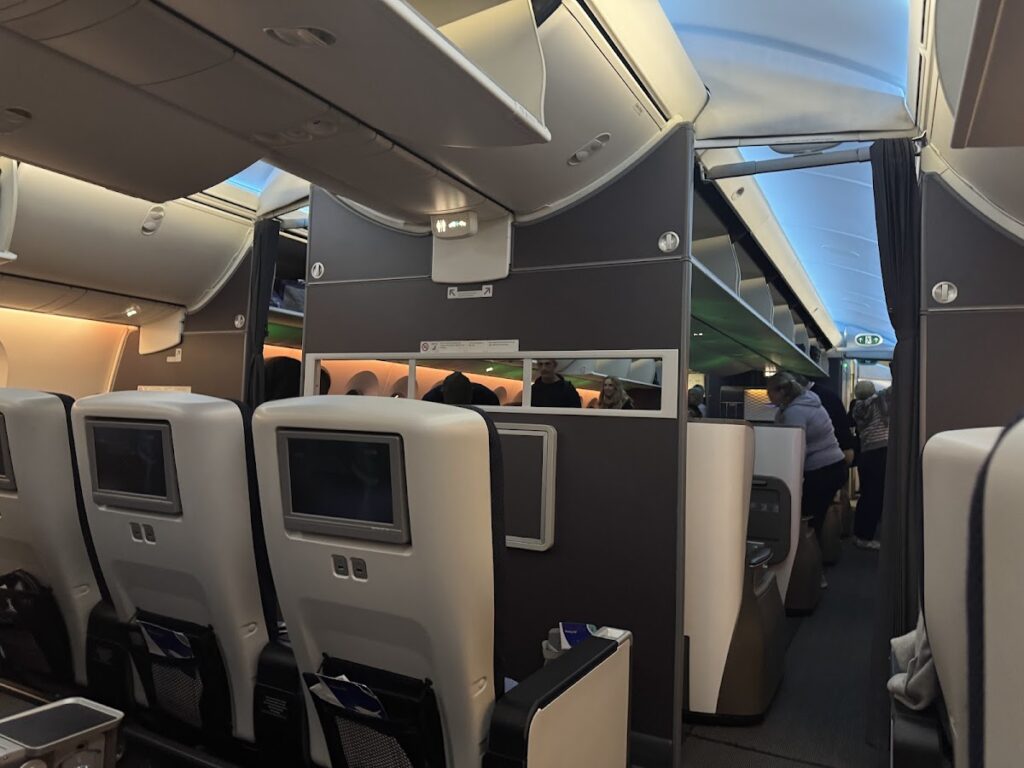 View from premium economy toward business class cabin divider