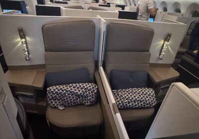 Etihad Business Class centre seats with pillows and blankets