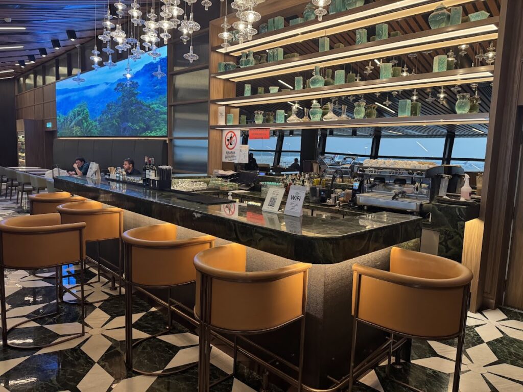 Marble bar with leather stools at Global Lounge KLIA