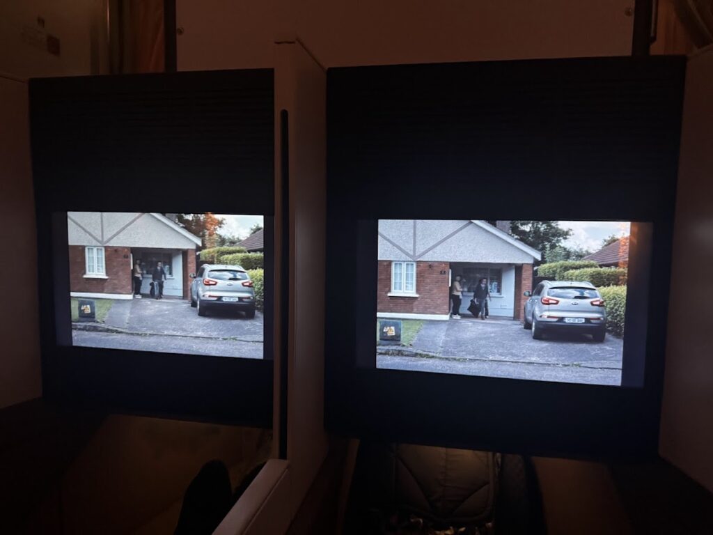 Two seatback IFE screens playing the same programme