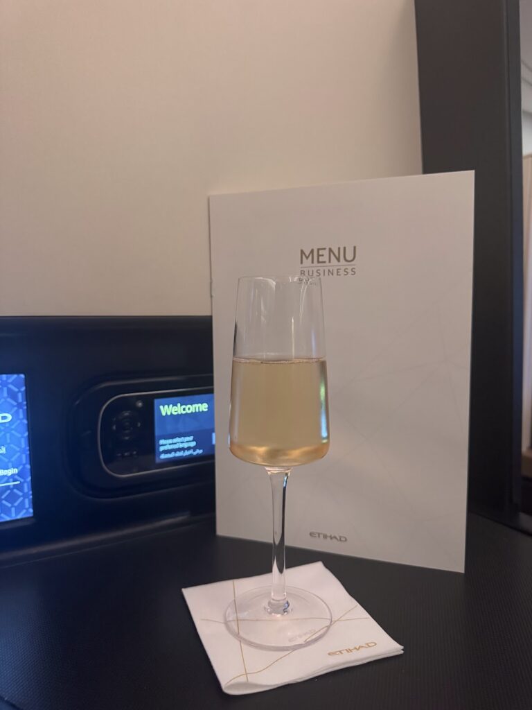 Welcome champagne and menu in Etihad Business Class