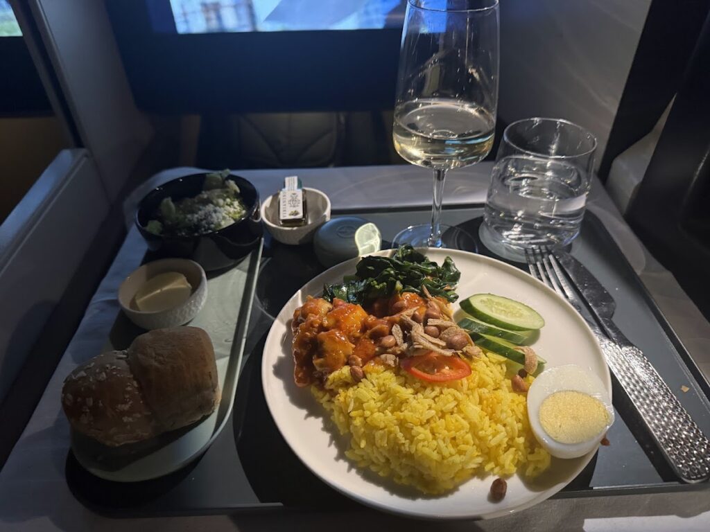 Main course with rice served in Etihad Business Class