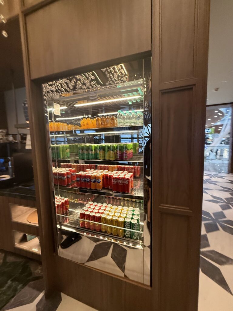 Stocked soft drink fridge at Global Lounge Kuala Lumpur Airport