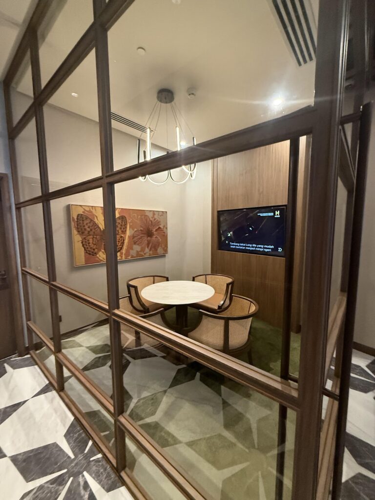 Private seating room with TV at Global Lounge