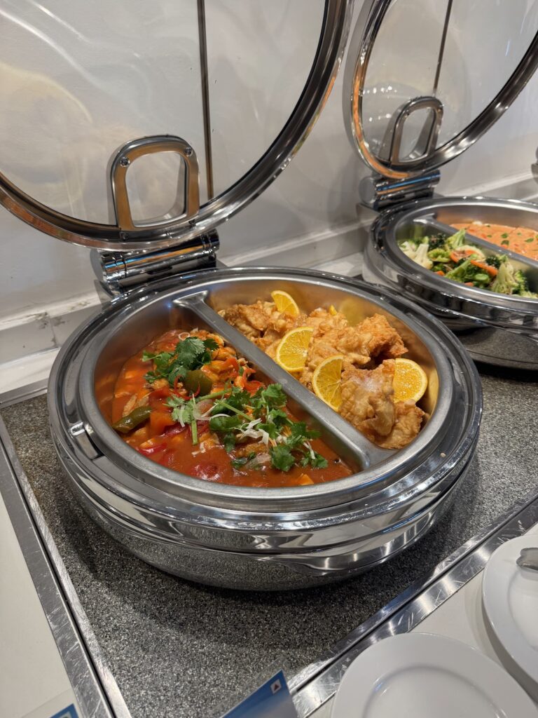 Hot buffet dishes at Travel Club Kota Kinabalu lounge